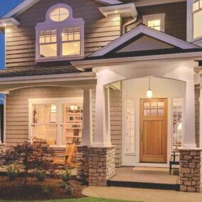 Pictured is the front of a home featuring a Rogue Valley door from Tucker Door and Trim.